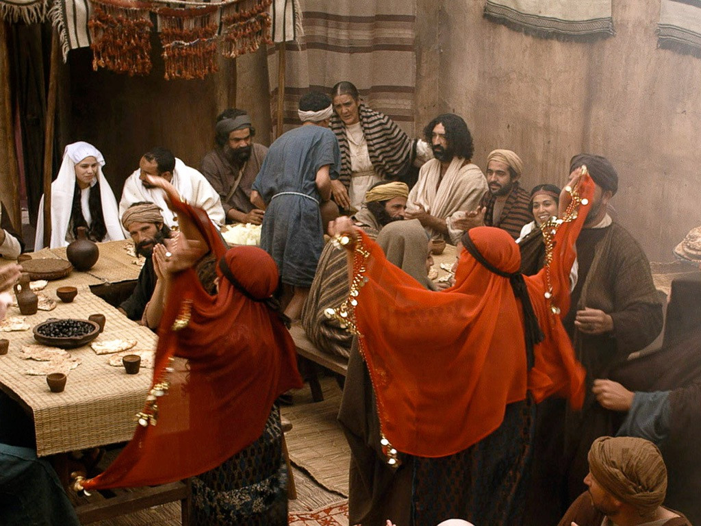 People dancing at the Wedding of Cana, where Jesus turns water into wine. John 2:1-11.